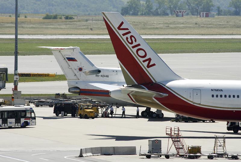 A Vision airlines plane reportedly carrying 10 Russian spies from U.S. sits on the tarmac at Vienna airport next to a Russian jetplane.