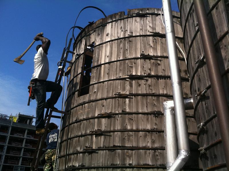 Working on one of the city's many watertanks.