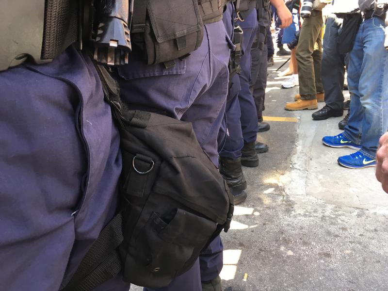 RNC protesters face off with police outside the Quicken Loans Arena in Cleveland.