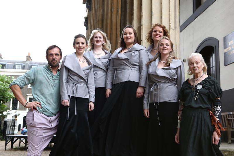 Members of the Monteverdi Choir, clad in their new jackets, pose with the designers Andreas Kronthaler and Vivienne Westwood.