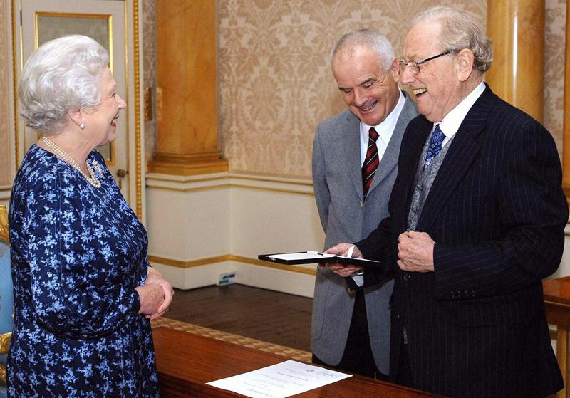 Britain's Queen Elizabeth II (L) presents the inaugural Queen's Medal For Music to Australian musician Sir Charles Mackerras (R) at Buckingham Palace in London.