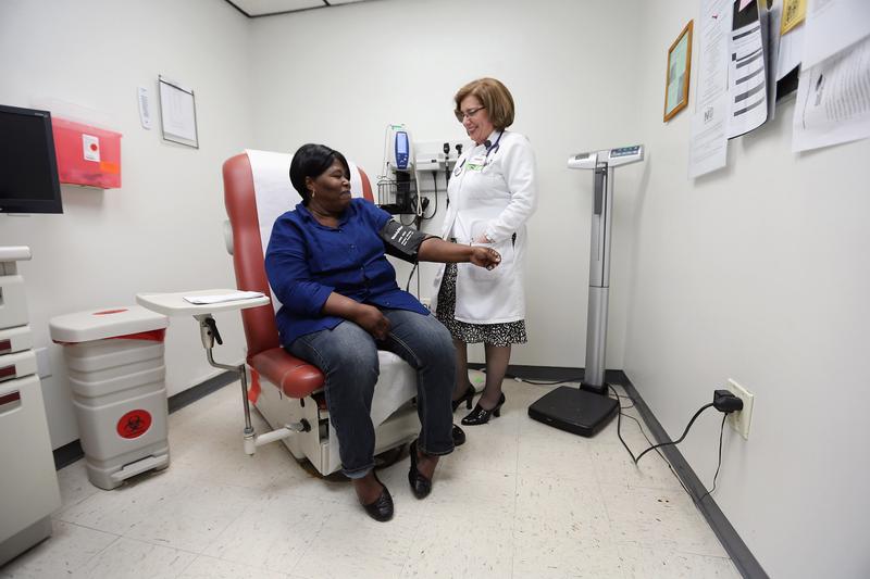 Dr. Martha Perez examines Dorothy Jolly in a room at the Community Health of South Florida, Doris Ison Health Center on February 21, 2013 in Miami, Florida. 