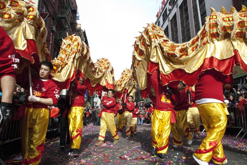 Pupeteers carry two traditional Chinese dragons at the Lunar New Year parade in Chinatown, NY.