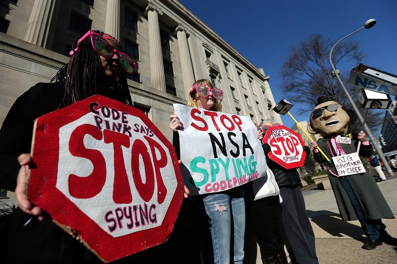  Activists protest the surveillance of U.S. citizens by the NSA outside the Justice Department where U.S. President Barack Obama gave a major speech on reforming the NSA on January 17, 2014.