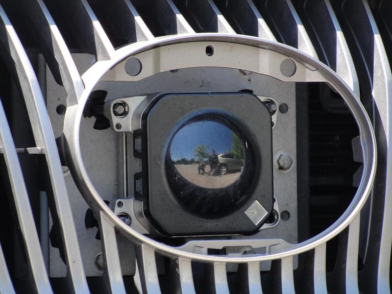 A camera peers out from the front grill of Google's self-driving car in Mountain View, California, on May 13, 2014. 