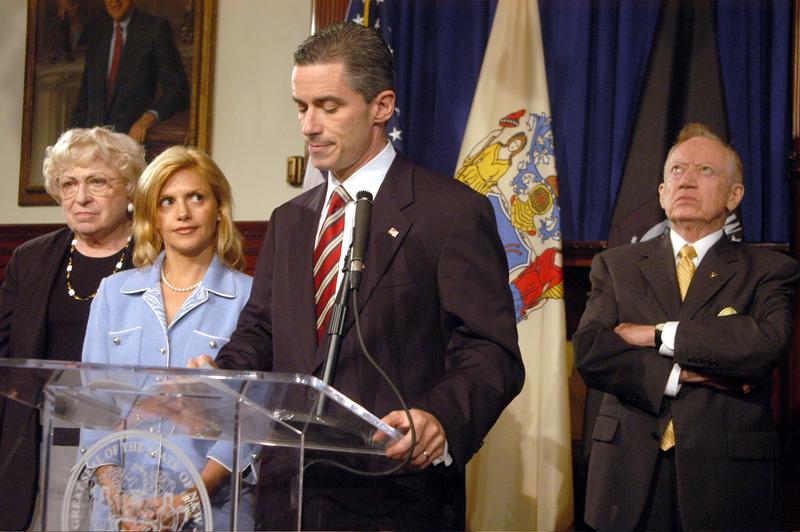 New Jersey Governor James McGreevey addresses the medeia with his wife Dina at his side where he admitted to being gay and to having an extramarital homosexual affair.