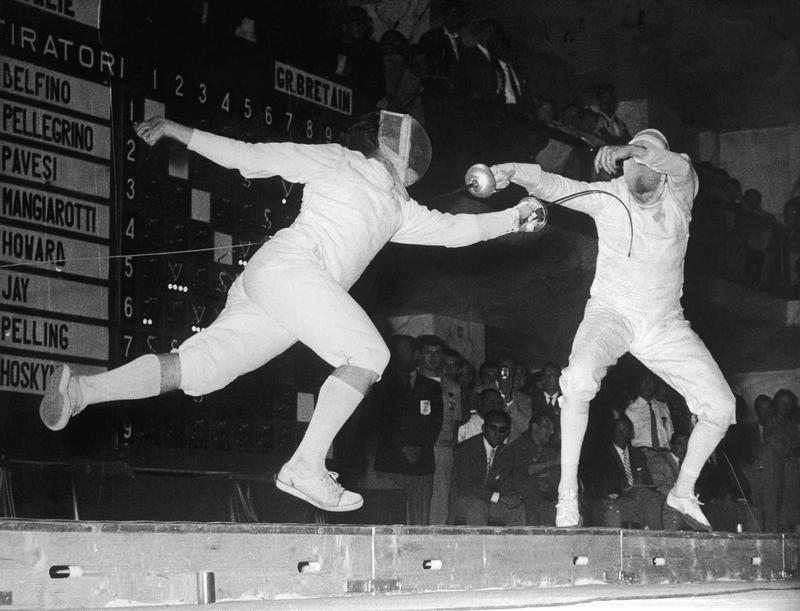 Giuseppe Delfino of Italy scores a winning hit on Allen Jay of Great Britain to take the gold in the Men's Individual Epee at the Rome Olympics, 1960 (Photo by Keystone/Hulton Archive/Getty Images)