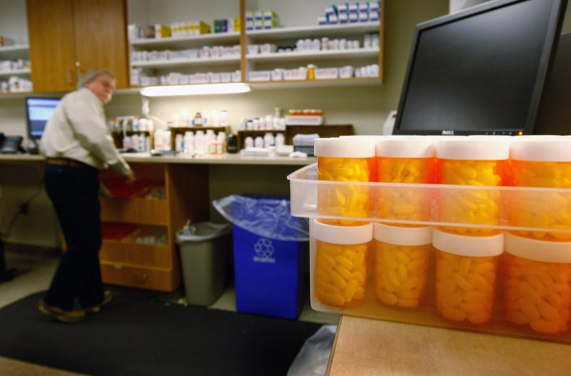 Pharmacist Hank Wedemeyer fills prescriptions as generic diabetes medicine awaits distribution at a community health center for low-income patients on December 1, 2009 in Aurora, Colorado.