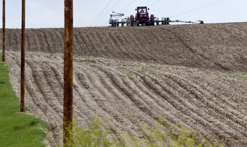 In this May 5, 2011 file photo, a farmer plants corn near Yutan, Neb. Farmers have planted the second-largest corn crop in nearly seven decades this spring.