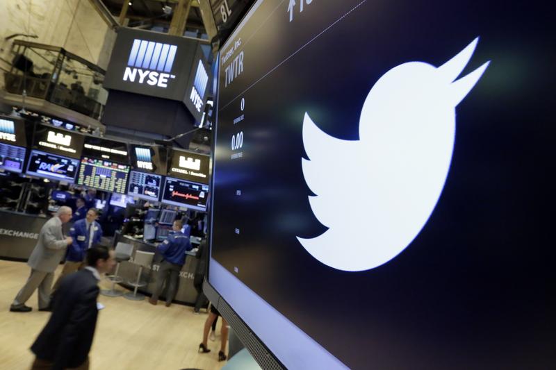 In this July 27, 2016, file photo, the Twitter symbol appears above a trading post on the floor of the New York Stock Exchange.