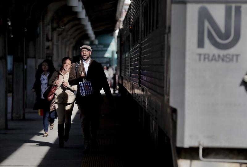 New Jersey Transit commuters rush to catch a train heading for Gladstone, N.J., Wednesday, April 5, 2017, in Hoboken, N.J.