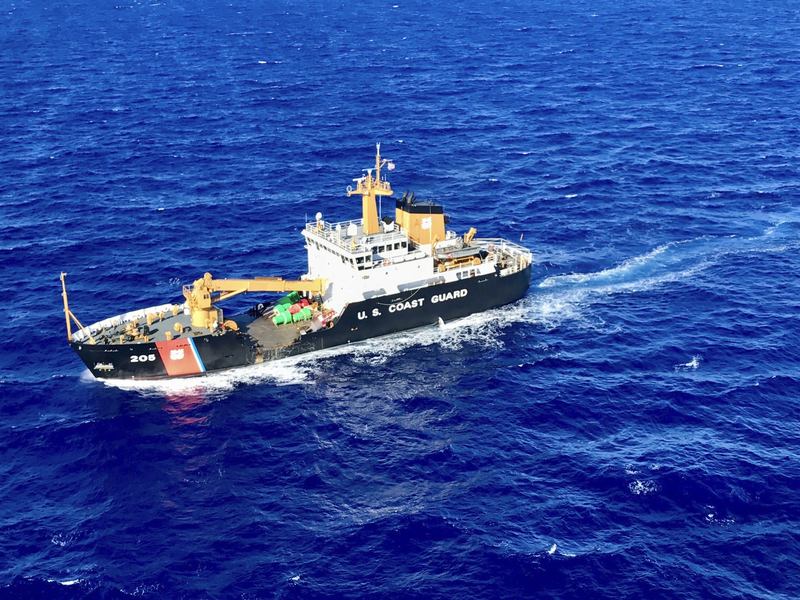 In this Friday, Aug. 18, 2017, photo provided by the U.S. Coast Guard, the crew of the Coast Guard Cutter Walnut (WLB 205) scan the waters off Oahu, Hawaii.