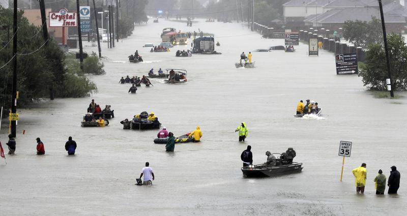 Rescue boats fill a flooded street in Houston, Texas. 