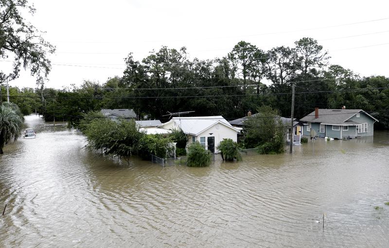 Water rises in a neighborhood after Hurricane Irma brought floodwaters to Jacksonville, Fla., Monday, Sept. 11, 2017.