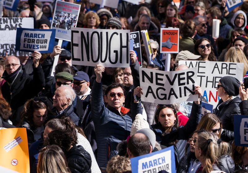 People take part in a march rally against gun violence Saturday, March 24, 2018, in New York