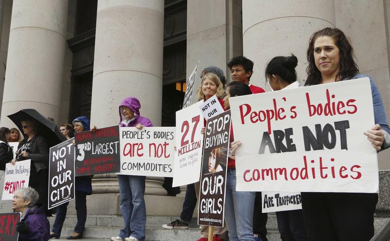 In this Oct. 21, 2014 file photo, people opposed to child sex trafficking rally outside of the Washington state Supreme Court in Olympia, Wash. The Washington Supreme Court ruled Sept. 3, 2015.