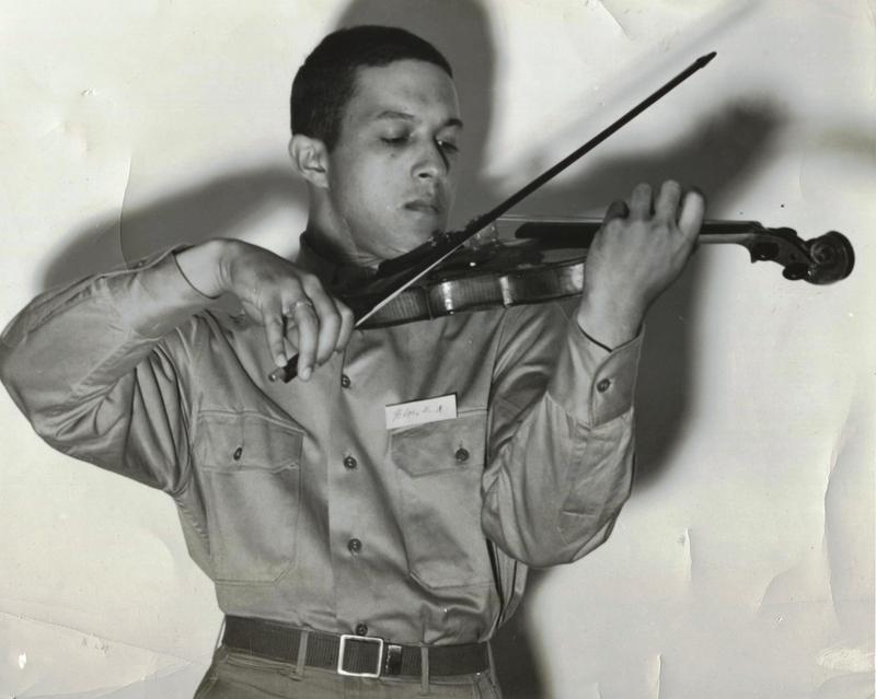 Everett Lee performs the violin in his Tuskeegee Airmen uniform in 1943.