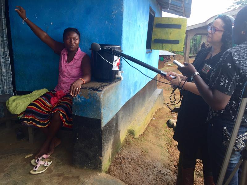 Brooke interviewing a quarantined woman in Jenewonde village, Liberia.