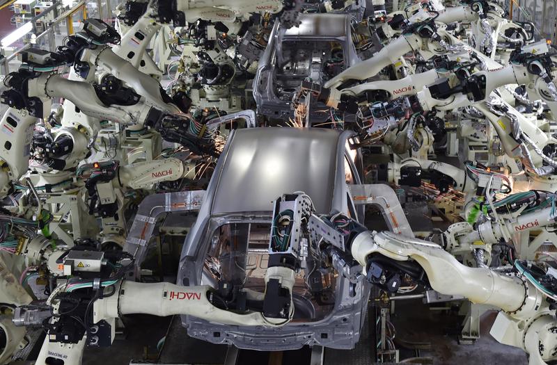 A general view shows the body welding workshop which uses automated welding machine robots that assemble automobile bodies called white body 