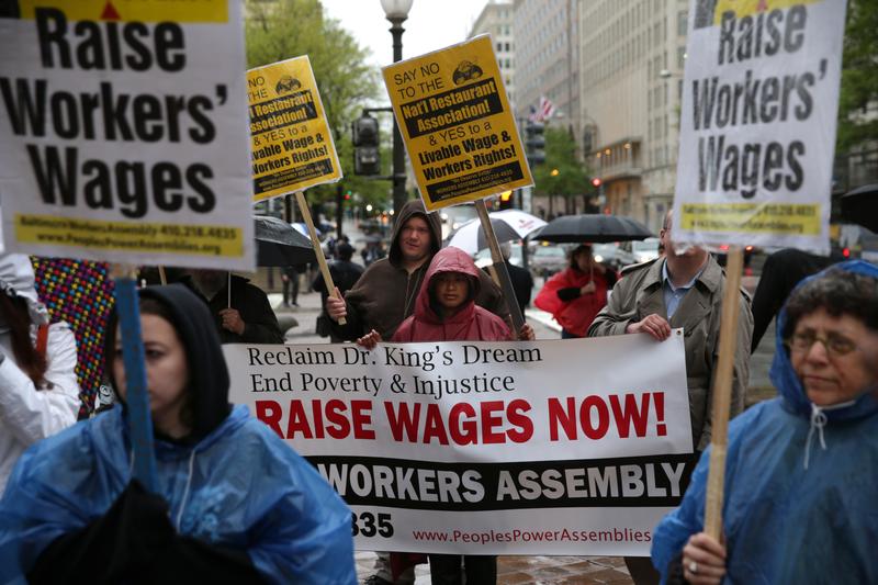 Activists demonstrate during a protest outside the National Restaurant Association's 28th Public Affairs Conference on April 29, 2014, in Washington, DC.