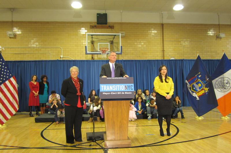 Bill de Blasio appointing Carmen Farina as Schools Chancellor at MS 51 in Brooklyn, with Ursula Ramirez (right) as her chief of staff