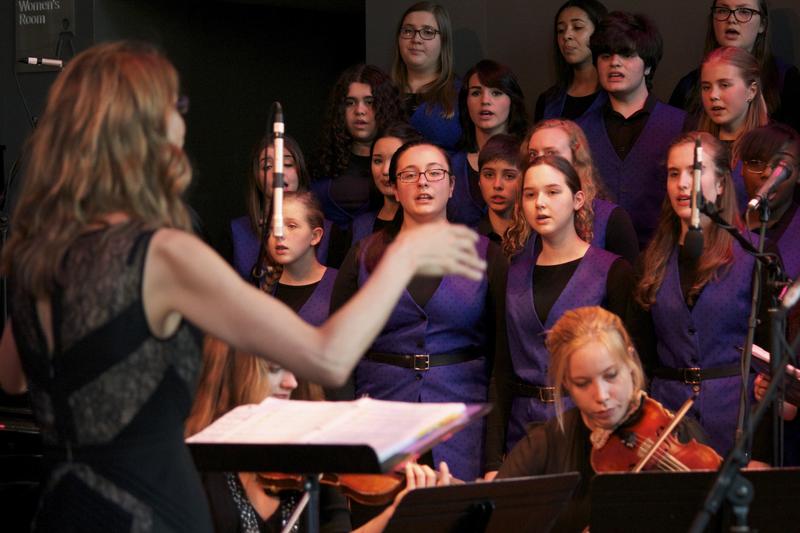 Dianne Berkun, founder and artistic director, leads the Brooklyn Youth Chorus in the BAMcafé on the last day of the 2013 Crossing Brooklyn Ferry festival.