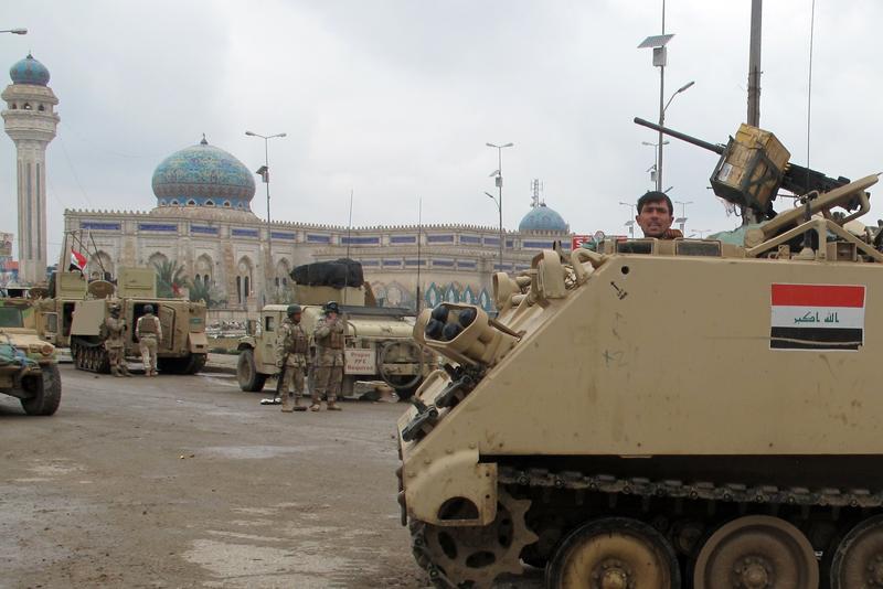 raqi security forces take position in the city of Ramadi, west of the capital Baghdad in the Anbar province, on February 4, 2014 during a military operation against anti-government fighters.