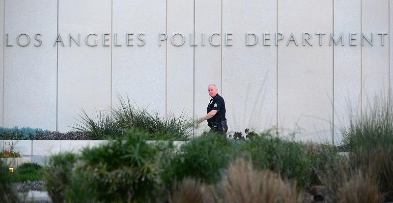 A Los Angeles Police Department (LAPD) officer walks to police headquarters in downtown Los Angeles on February 12, 2013 in California.
