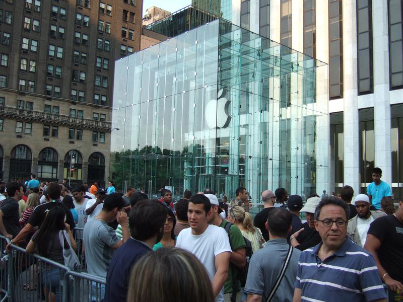 Apple aficionados wait in line around the Apple Store on Fifth Avenue in New York City in anticipation of a new product.