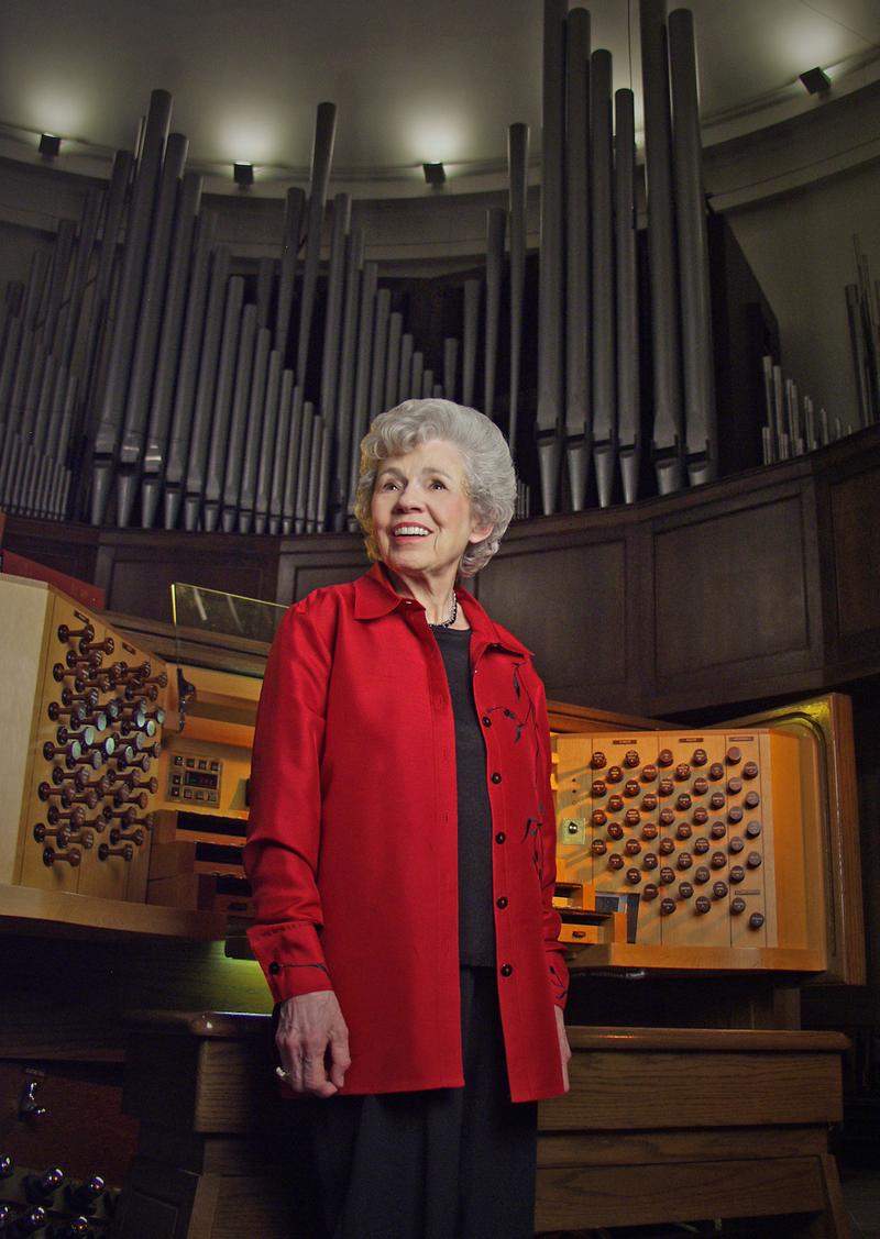 Wilma Jensen in front of the Casavant console  at St. George's Episcopal Church in Nashville.