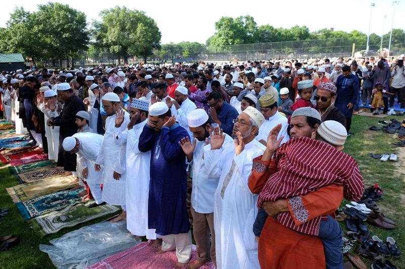 Muslim faithfuls take part in a special morning prayer to start their Eid al-Fitr celebrations on a field at the Prospect Park in Brooklyn borough of New York on July 17, 2015.