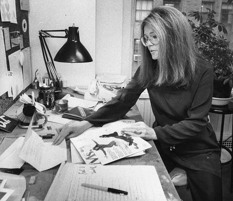 Gloria Steinem, feminist leader and founder of 'Ms.' magazine, at her desk. 