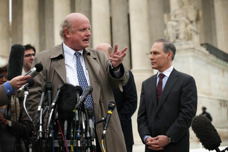 Michael Carvin (L), lead attorney for the petitioners and partner at Jones Day, speaks to members of the media as Attorney General of Oklahoma Scott Pruitt (R) listen outside the U.S. Supreme Court.