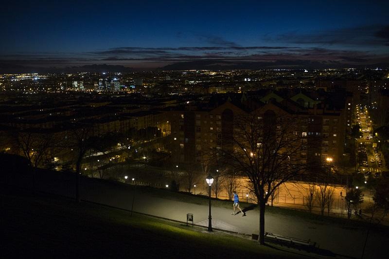 A man jogs at dusk in the Tio Pio park in Madrid, Wednesday, March 9, 2016. The park is a high viewpoint frequented mostly by locals due to its view of the Spanish capital skyline. 