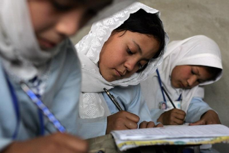 Young Afghan girls work on their studies during class Tuesday, August 29, 2006 at the Marefat School in Kabul.