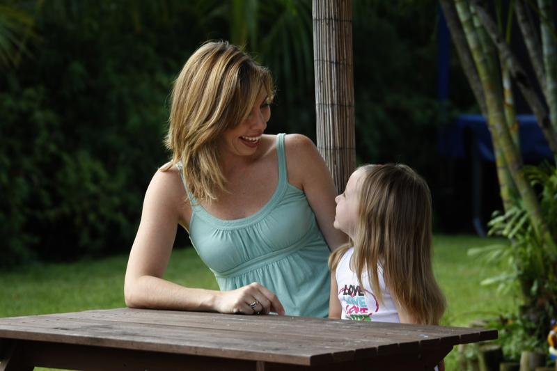 Mother talking to her daughter.