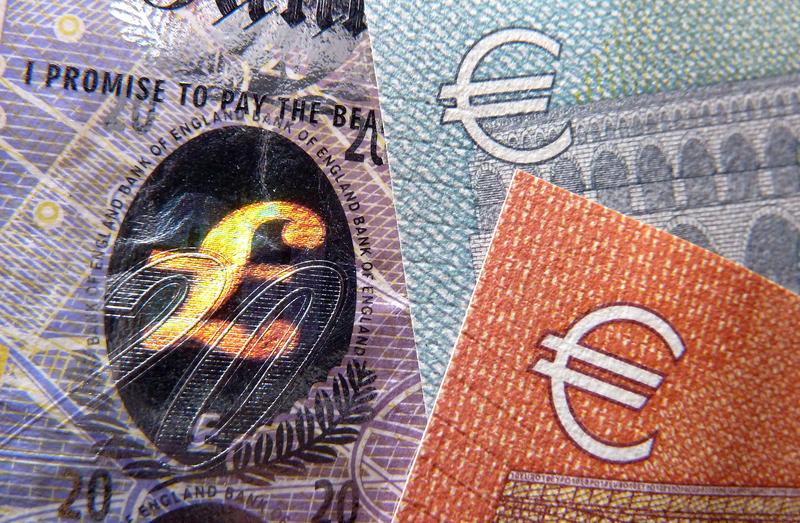 A detail of a twenty Pound bank note with hologram design and a five and ten Euro note, on March 7, 2016.