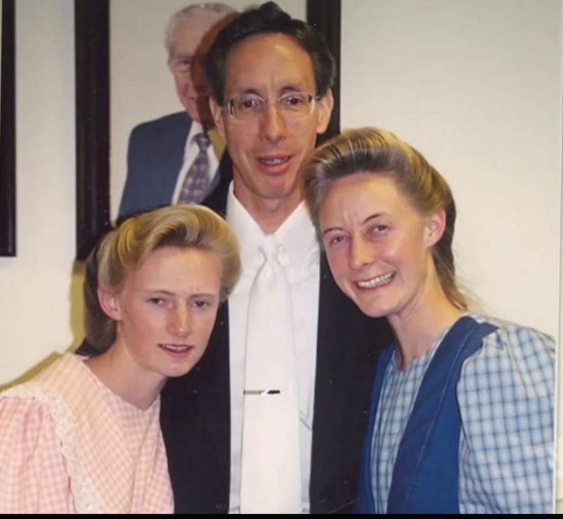 Screenshot of the documentary, "Prophet's Prey" showing Warren Jeffs with two female members of the FLDS.