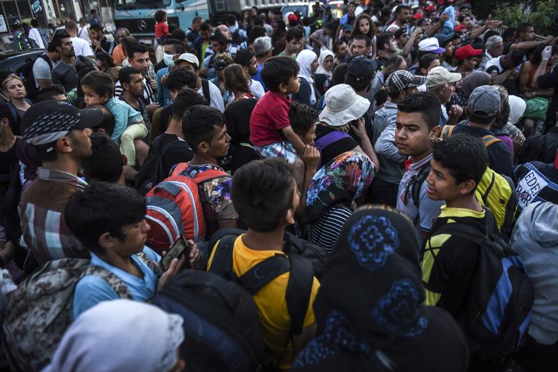 Migrants arrive at the refugee center in the town of Presevo, after walking from Macedonia to Serbia on August 26, 2015. Many hope to travel to Hungary, the door to the E.U.