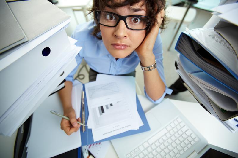 Overwhelmed woman at work