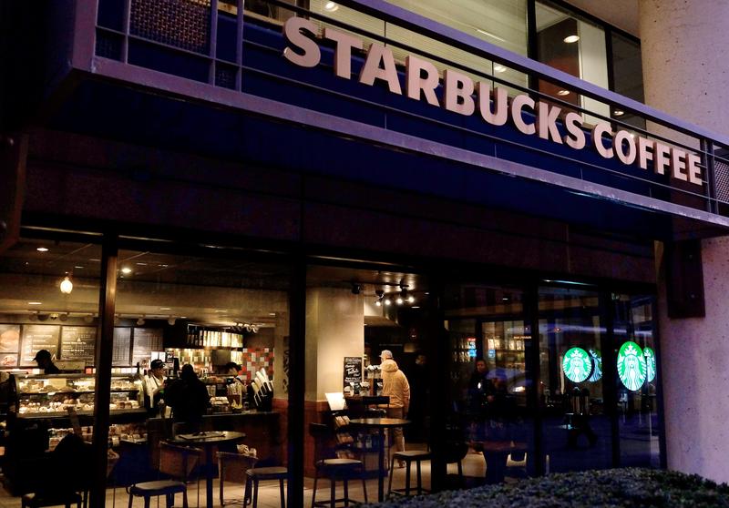 A Starbucks store is seen March 18, 2015 in Washington, DC. Starbucks customers can now add discussion about racism to their latte order.