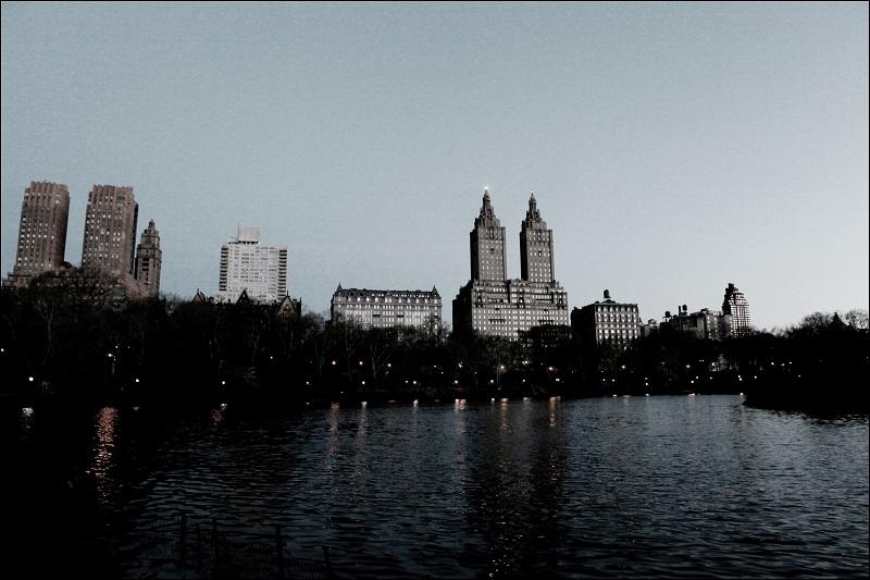 Early morning view (from Cherry Hill) across The Lake in Central Park of the San Remo apartments (145-146 Central Park West, between 74th and 75th streets), Manhattan's Upper West Side neighborhood. 
