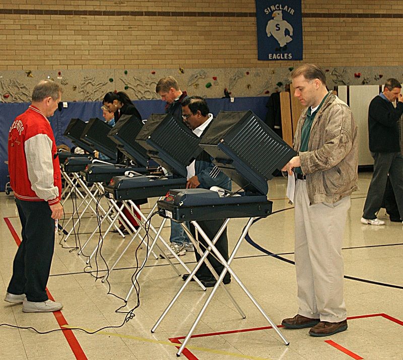 Voters cast their ballots on electronic voting machines 07 November, 2006 at the Sinclair Elementary School in Prince William County, Virginia.