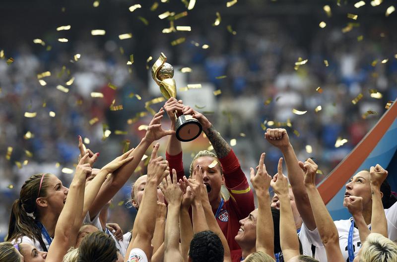USA players celebrate their victory in the final football match between USA and Japan during the 2015 FIFA Women's World Cup at the BC Place Stadium in Vancouver on July 5, 2015. USA won 5-2.