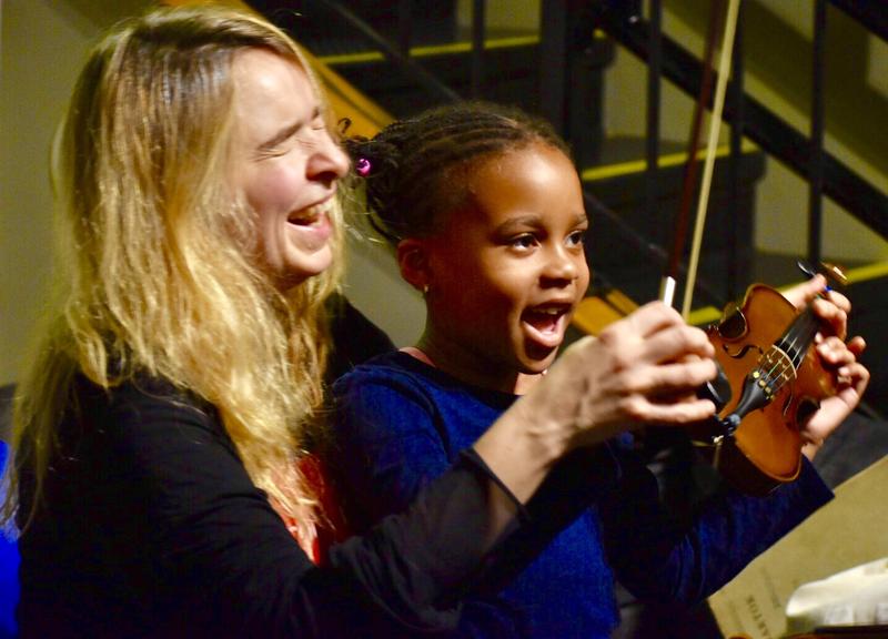 Learning about the violin at WQXR's Classical Kids Fair.
