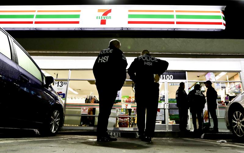 ICE agents outside a 7-Eleven store in Los Angeles on Jan. 10, 2018.