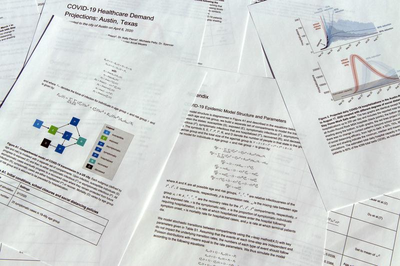 A report delivered on COVID-19 health care demand is photographed. 