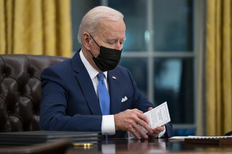 In this Feb. 2, 2021, file photo President Joe Biden delivers remarks on immigration, in the Oval Office of the White House in Washington. 