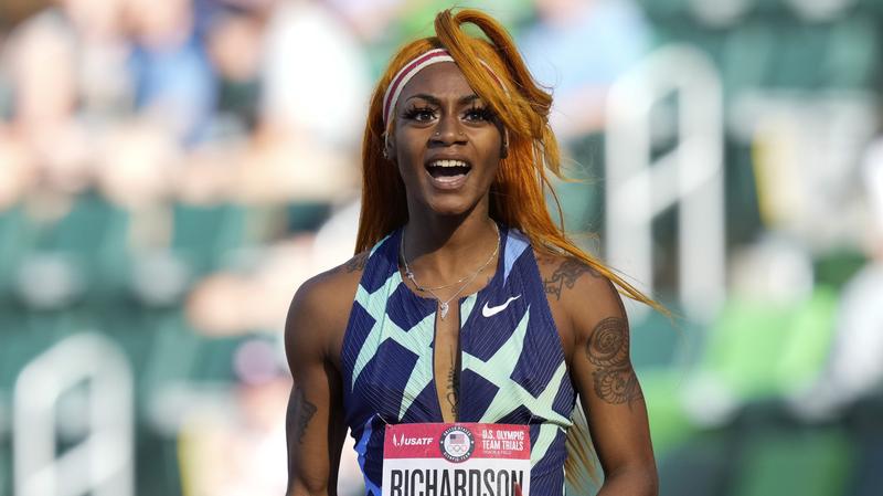 Sha'Carri Richardson celebrates after winning the first heat of the semi-finals at the U.S. Olympic Track and Field Trials. She cannot run in the Olympics because of a positive drug test.