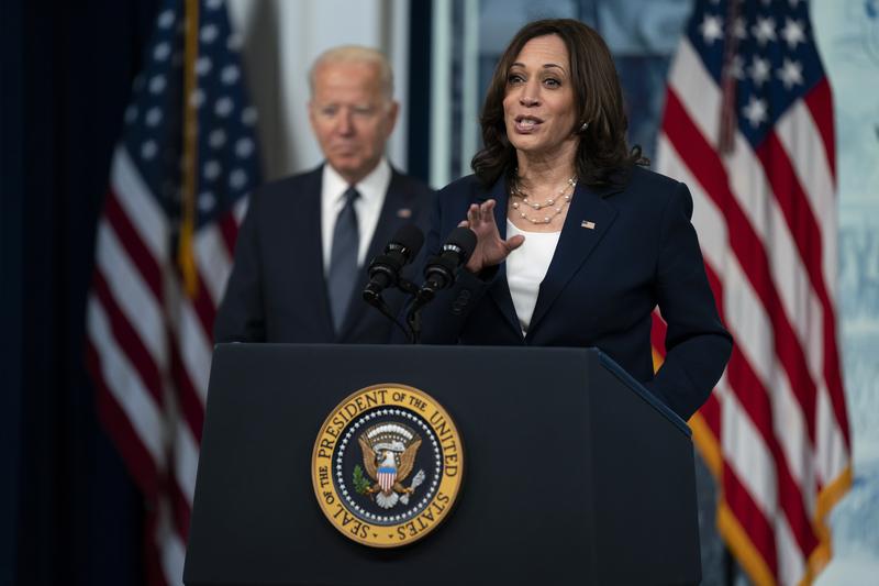President Joe Biden listens as Vice President Kamala Harris speaks during an event to mark the start of monthly Child Tax Credit relief payments, in the South Court Auditorium on the White House compl